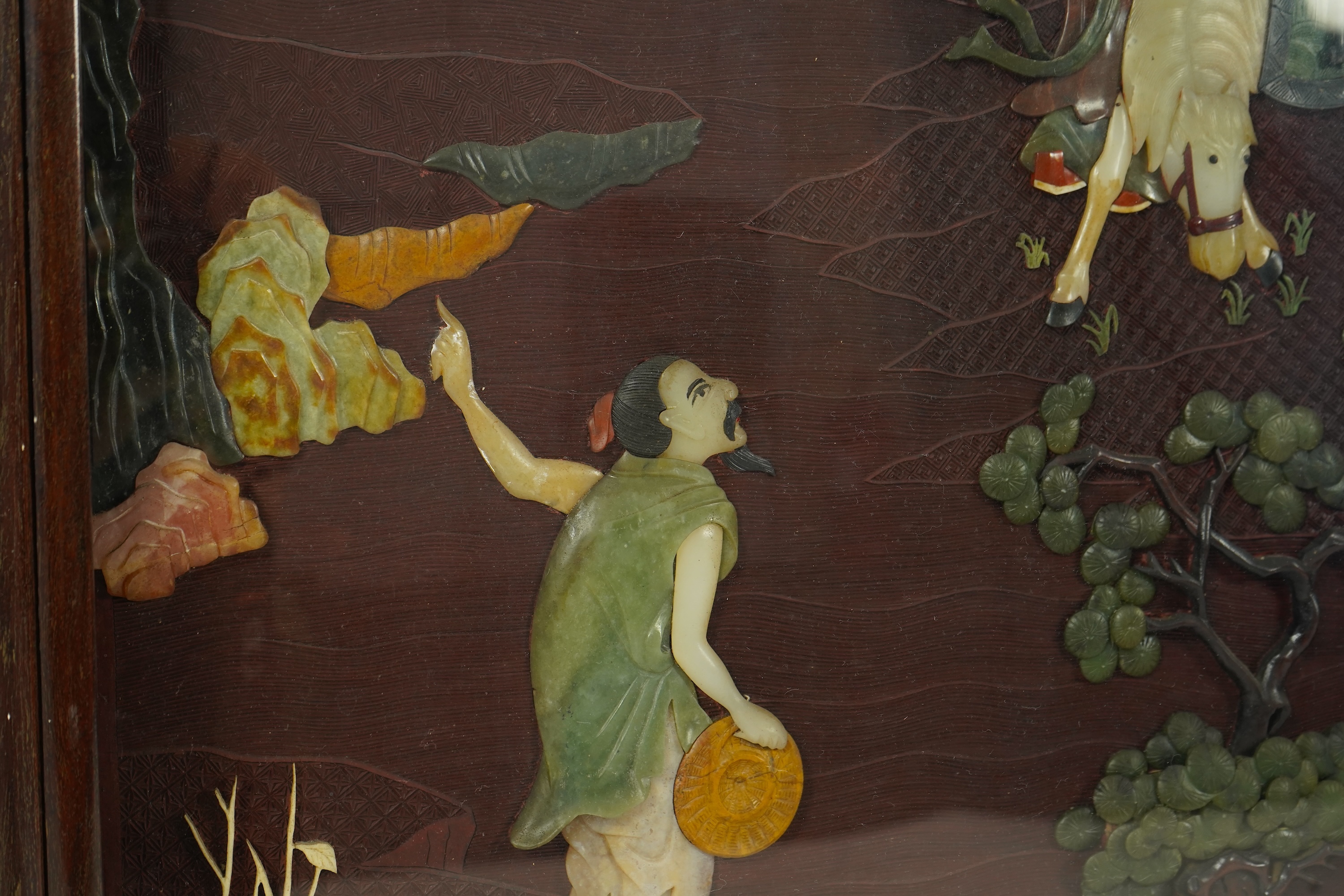 A Chinese carved cinnabar lacquer and hardstone mounted panel, early 20th century